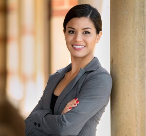 Beautiful young adult lawyer business woman professional in a suit at the courthouse