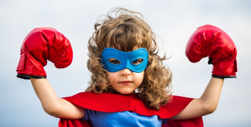 Superhero kid. Girl power concept